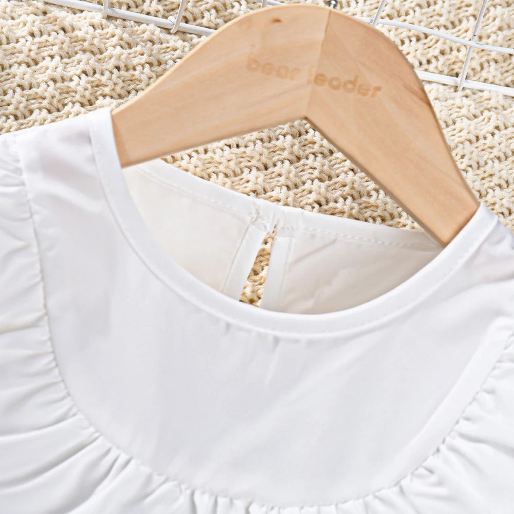 Stylish Girl's White Top With Ruffled Round Neck